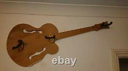 Hand-made hardwood guitar hanger in shape of Gretsch semi-acoustic