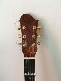 Left handed Hand made accoustic guitar. Cuban Mahogany back, sides and neck